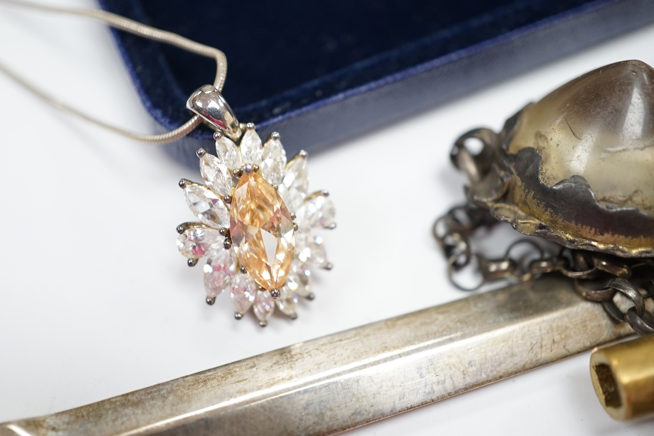 A small group of jewellery, silver and other collectables including a modern silver meat skewer, 20.6cm, silver napkin rings, Swiss 935 white metal pocket watch, unmounted cut stones, pen, opera glasses etc.